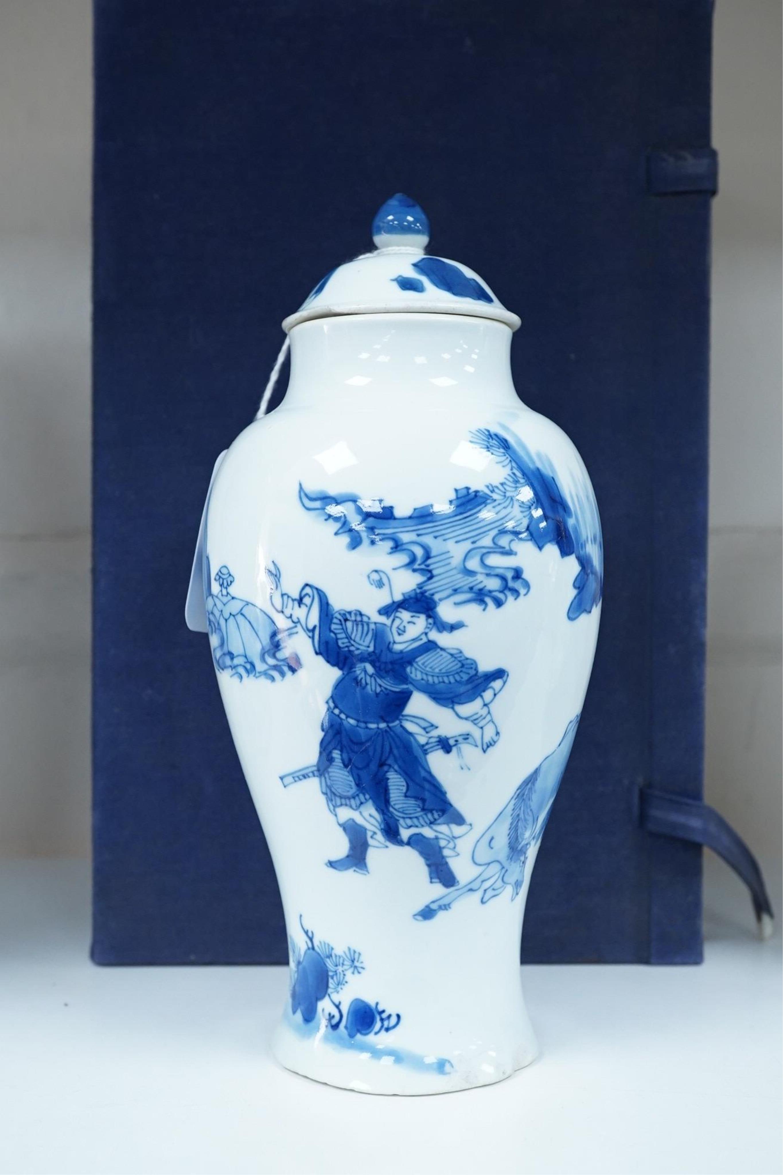 A Chinese blue and white baluster vase, early Kangxi, and associated cover